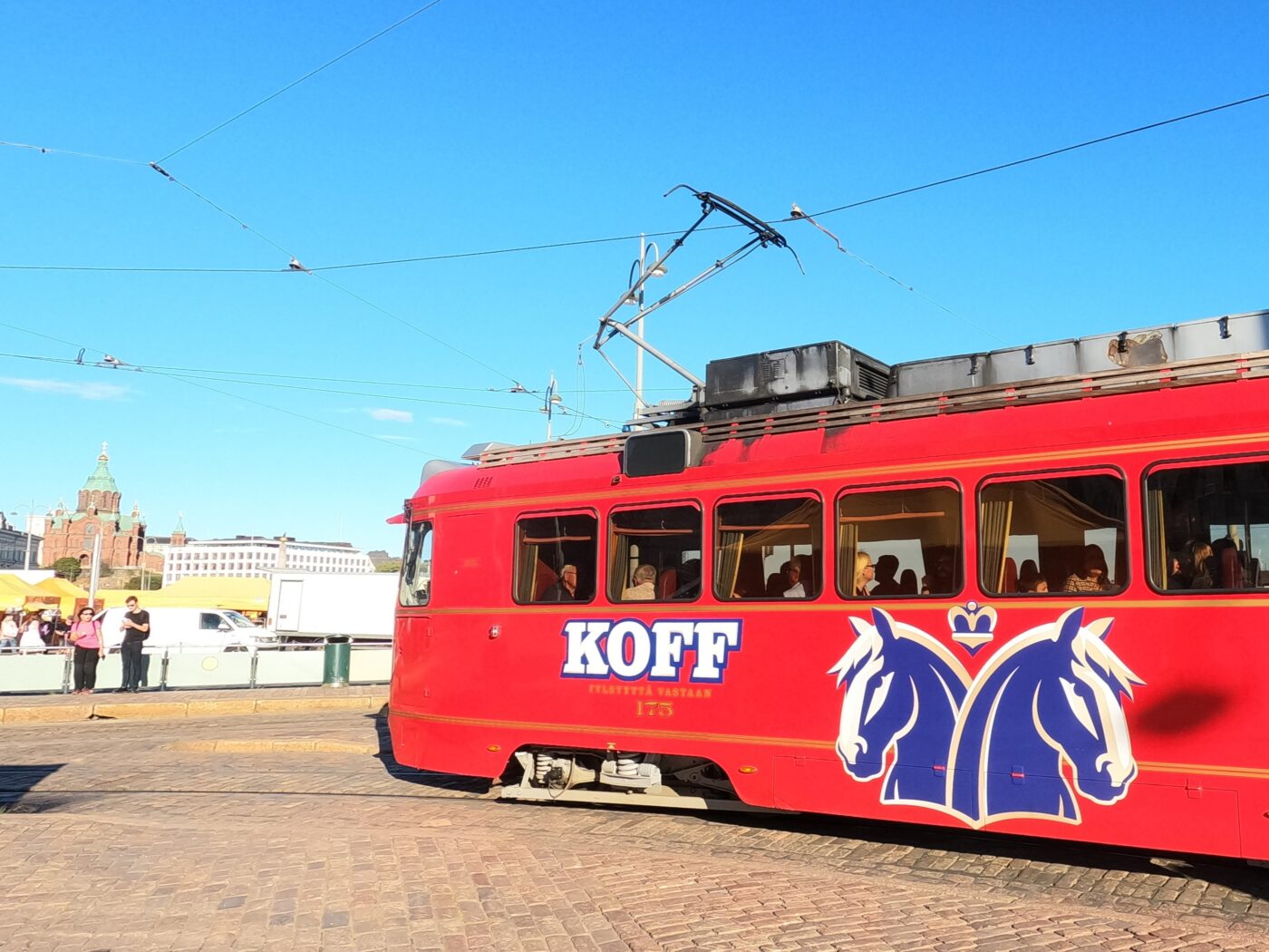 A red Koff tram in Helsinki.